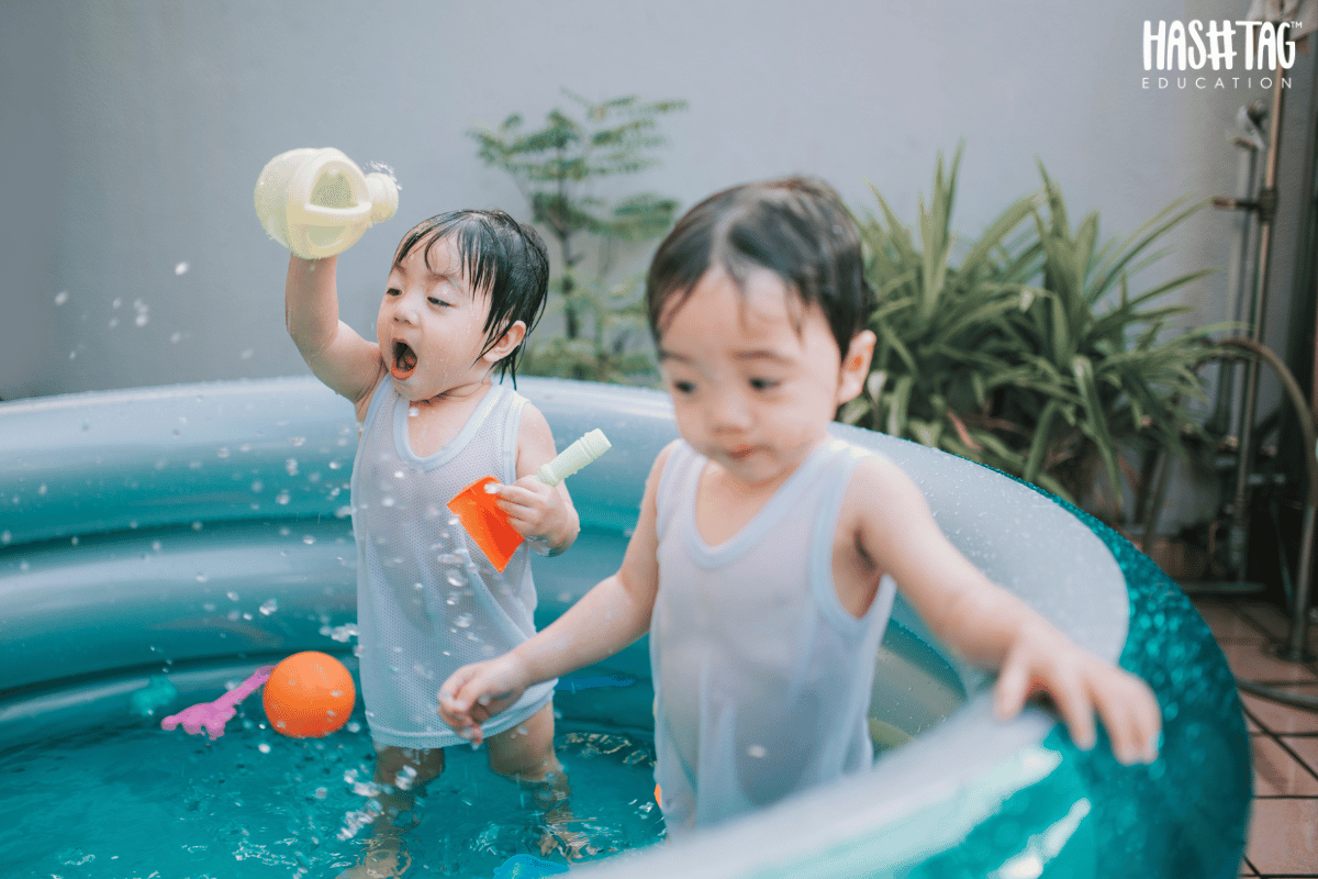 Water Play Activities for Toddlers enjoying splashing and learning through fun water games